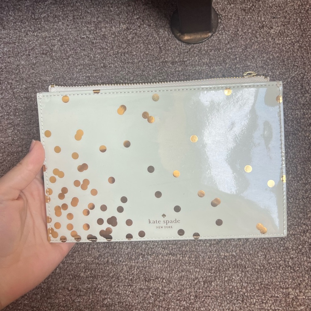 White and gold polka dot patent leather Kate spade pouch